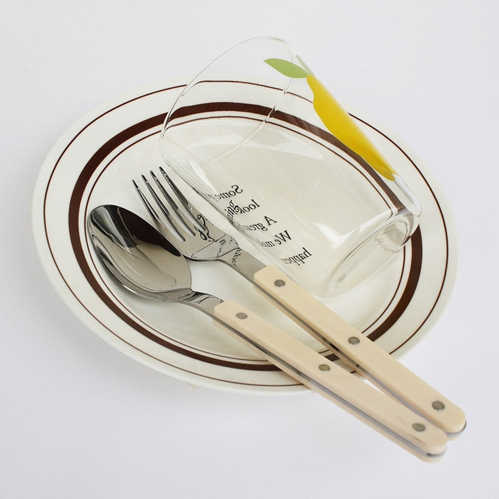 BistroLine black stainless steel cutlery set full 24-piece layout on white background
