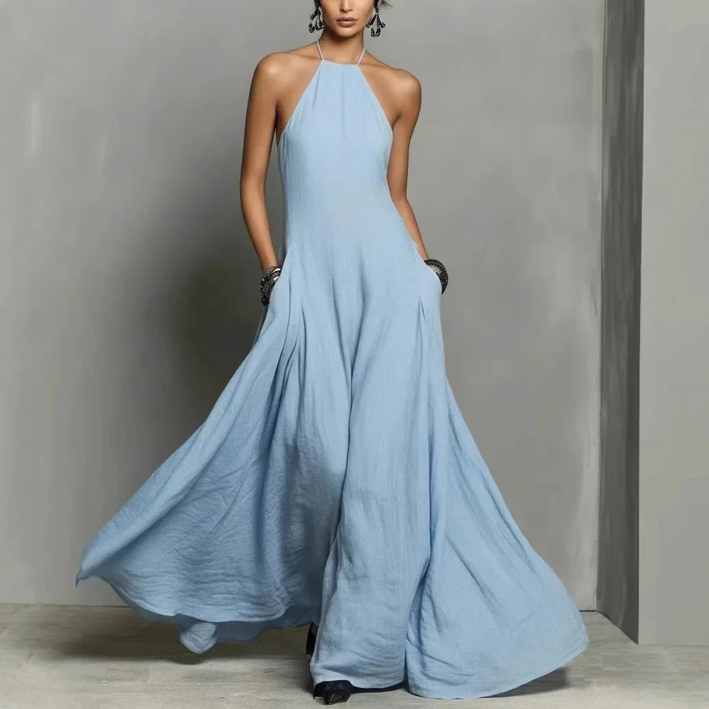 Halter neck maxi dress in pale blue with flowing floor-length silhouette and tie-back neckline