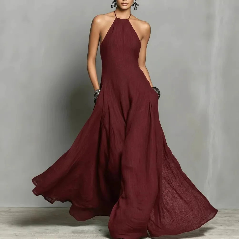 Rear view of halter neck maxi dress showing tie-back closure and flowing skirt movement