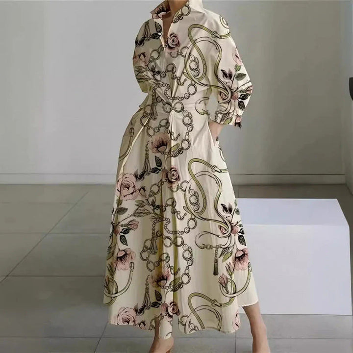 Close-up view of newspaper print collared maxi dress showing graphic text motifs and structured collar