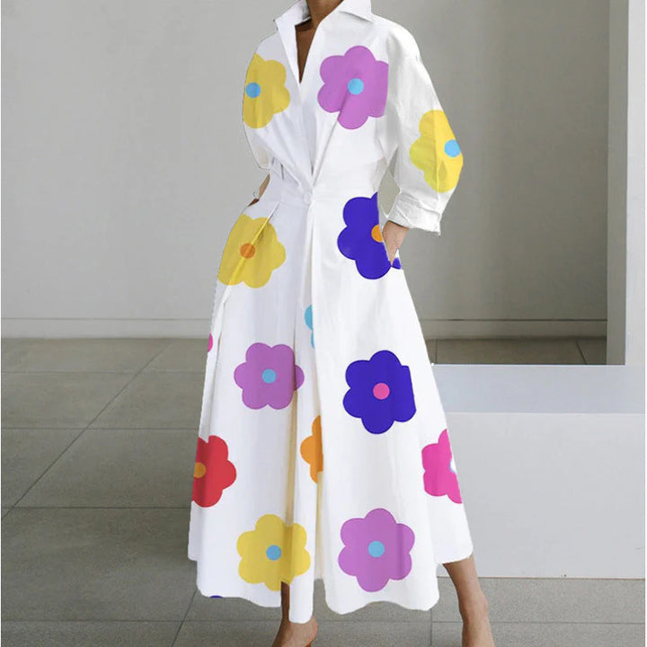 Full-length newspaper print collared dress displayed flat showing complete silhouette and print placement