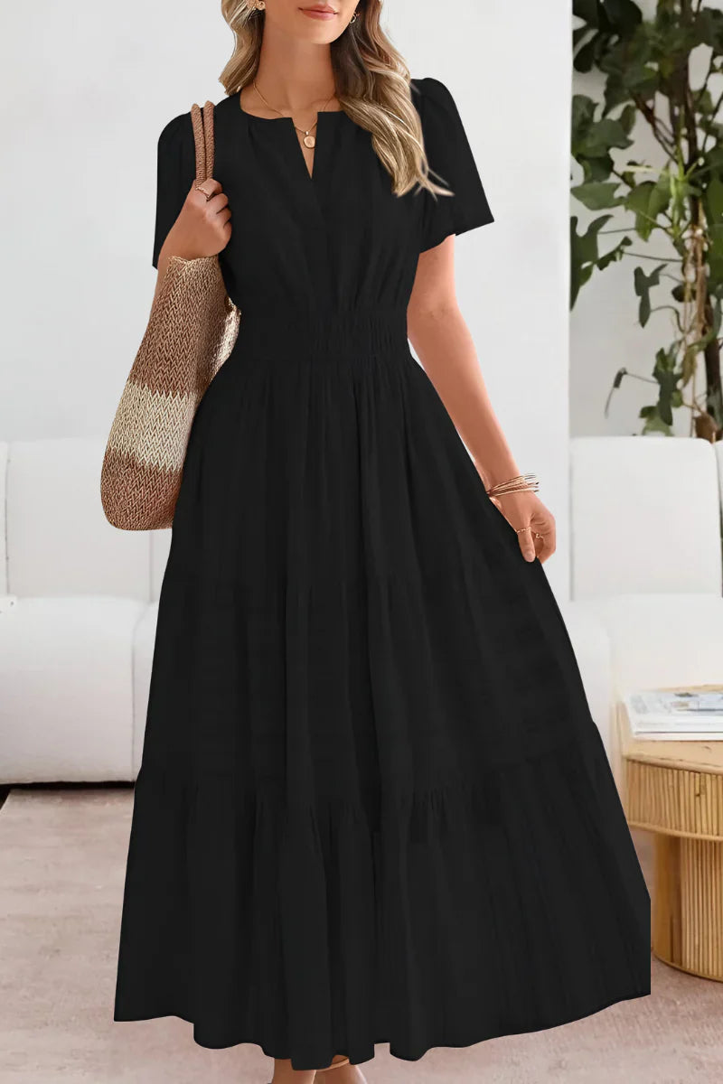 Close-up view of tiered midi dress showing textured stripe detail and relaxed A-line silhouette