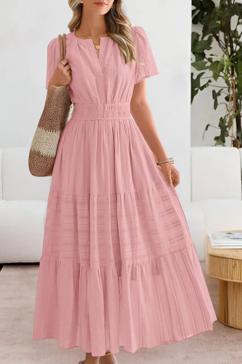 Full-length view of tiered midi dress in yellow showing relaxed fit and midi hemline
