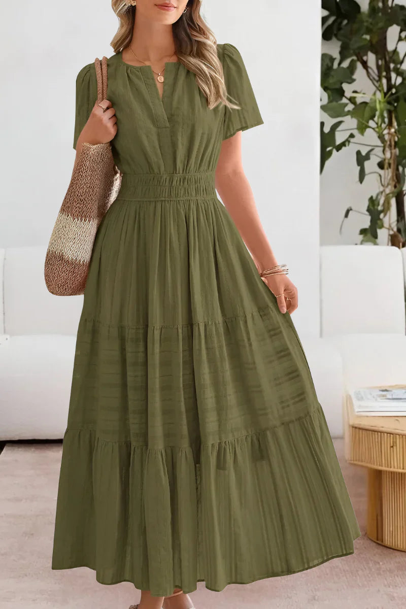 Tiered midi dress styled for casual summer wear with sandals and accessories