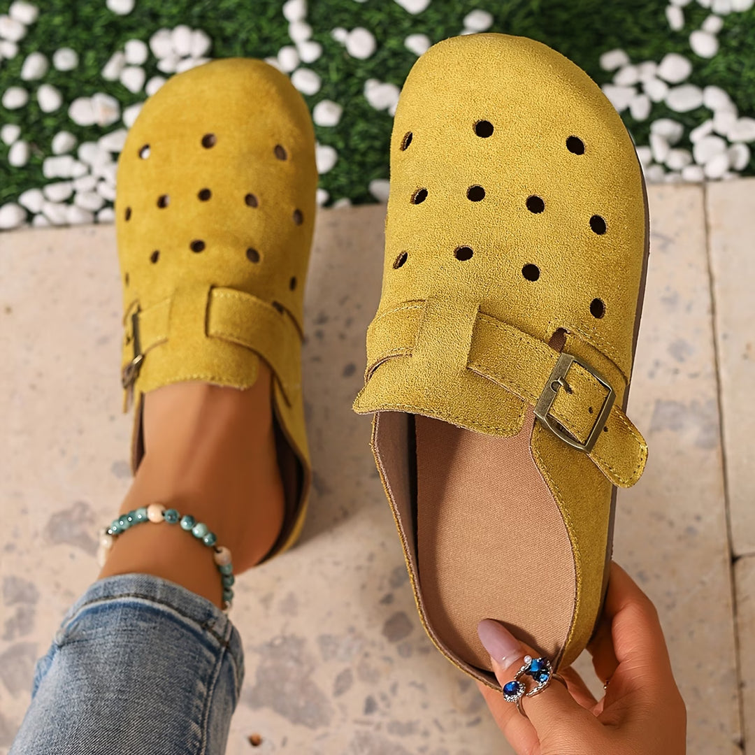 Close-up view of women's slip-on garden clogs showing breathable perforated detailing and rounded toe design