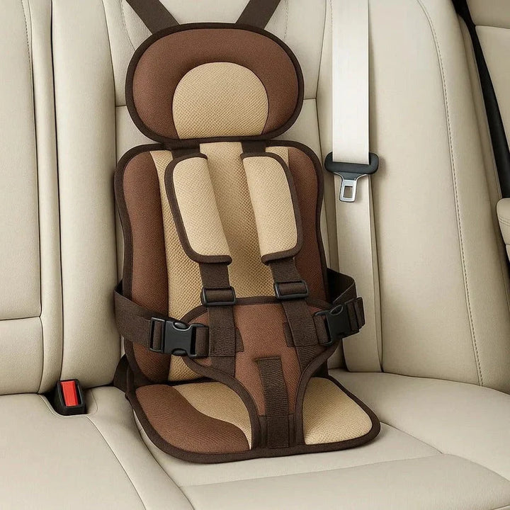 Portable foldable car seat with blue cushions and black restraint straps designed for rapid setup in hire cars