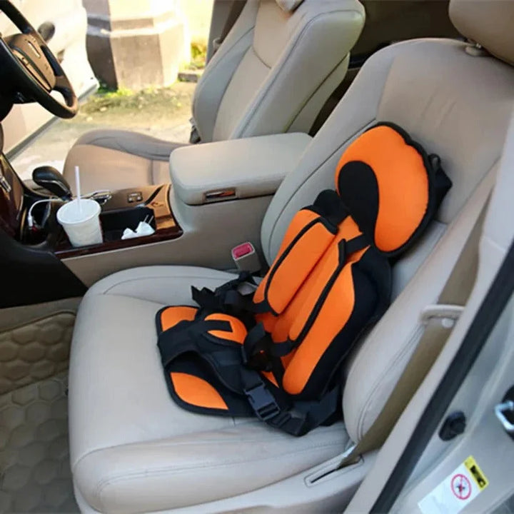 Child travel seat with five-point harness and supportive padding offering secure positioning for everyday vehicle use