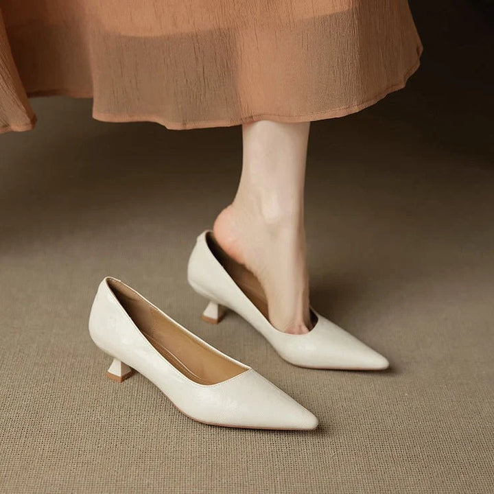 Side profile of pointed-toe stiletto heels with slip-on design and low heel height