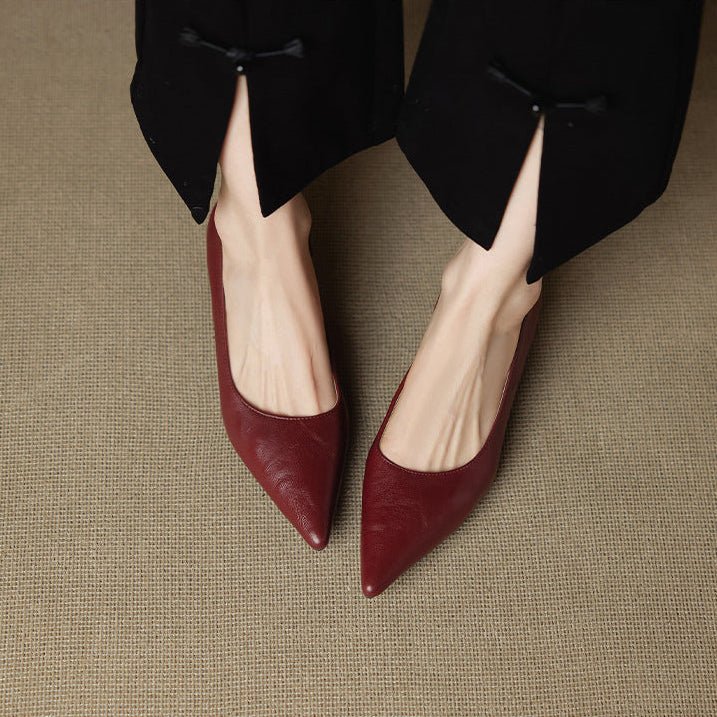 Detail of slip-on leather heels showing smooth finish and refined stiletto heel construction