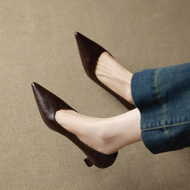 Close-up of women's leather heels showing structured upper and smooth burgundy finish