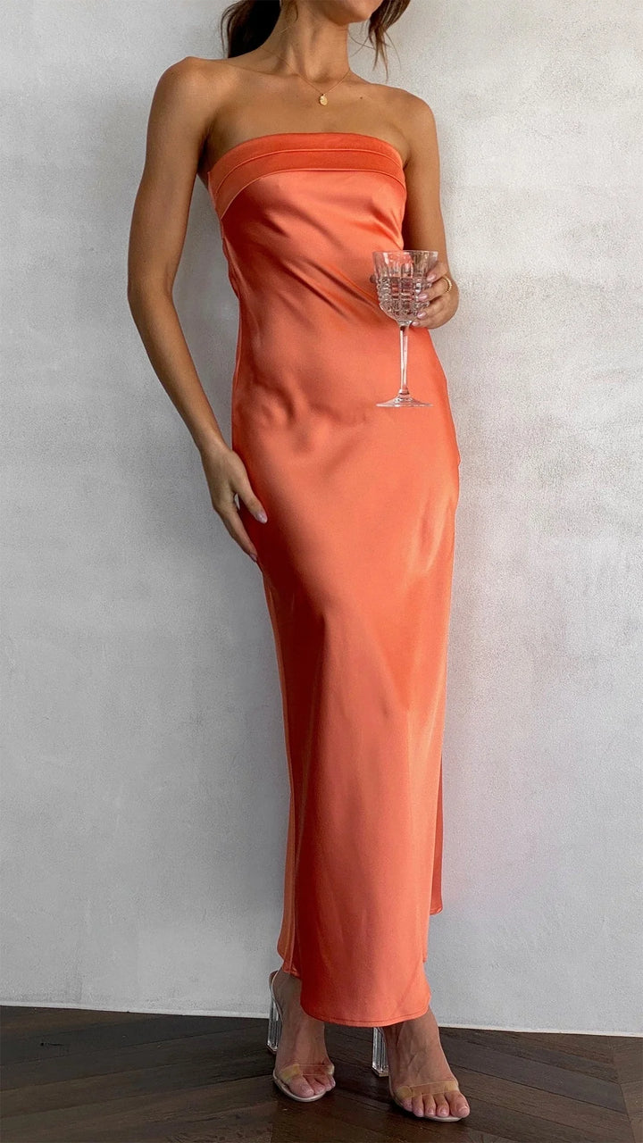 Close-up view of strapless satin midi dress showing smooth fabric drape and straight neckline detail