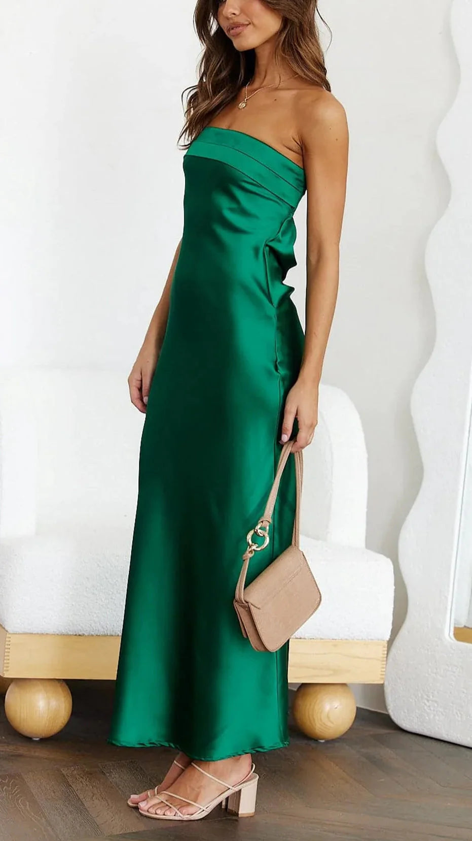 Strapless satin midi dress shown in natural lighting highlighting fabric sheen and colour