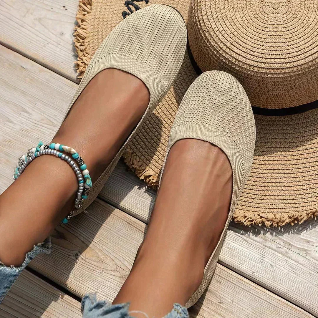 Detail of women's slip-on flats highlighting breathable knit upper and cushioned construction