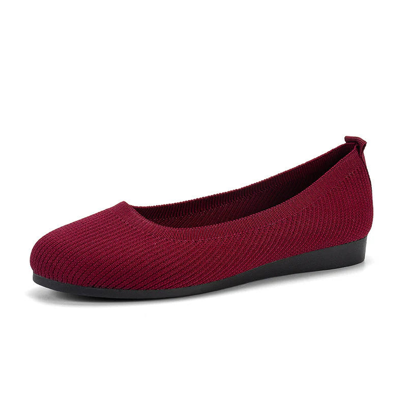 Overhead angle of women's knit slip-on flats in grey with supportive insole and flexible build