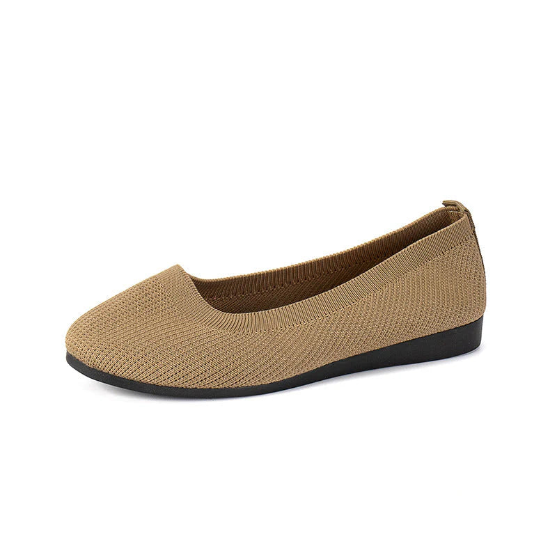 Women's slip-on flats in grey knit fabric showing rounded toe and slip-resistant rubber outsole