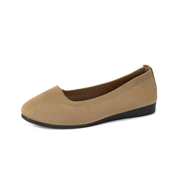 Women's slip-on flats in grey knit fabric showing rounded toe and slip-resistant rubber outsole