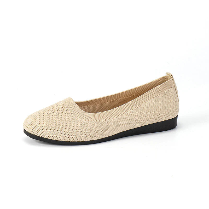 Full shot of women's ribbed knit flats displaying casual silhouette and arch support features