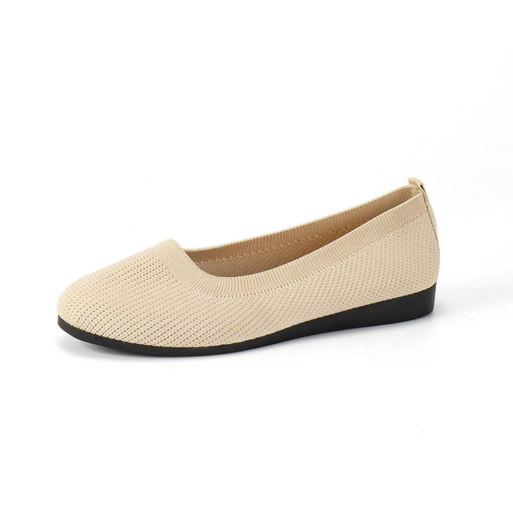 Full shot of women's ribbed knit flats displaying casual silhouette and arch support features