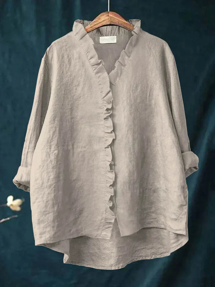 Back view of relaxed silhouette blouse showing curved hemline and comfortable fit for all-day wear