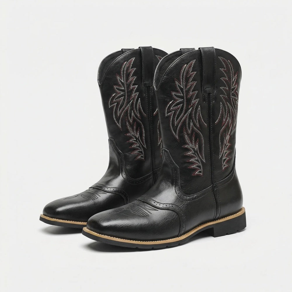 Claude calf-length cowboy-style boots in black, pair view