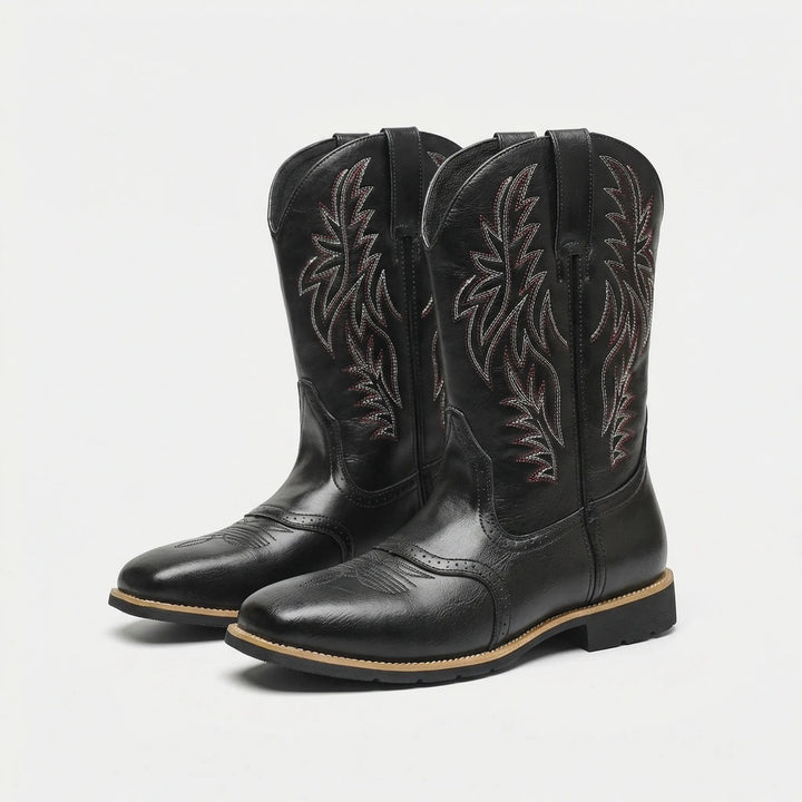 Claude calf-length cowboy-style boots in black, pair view