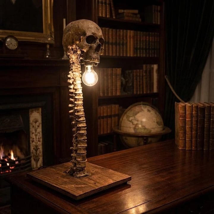 Decorative Skull Table Lamp styled on a dark wooden desk in a gothic study setting