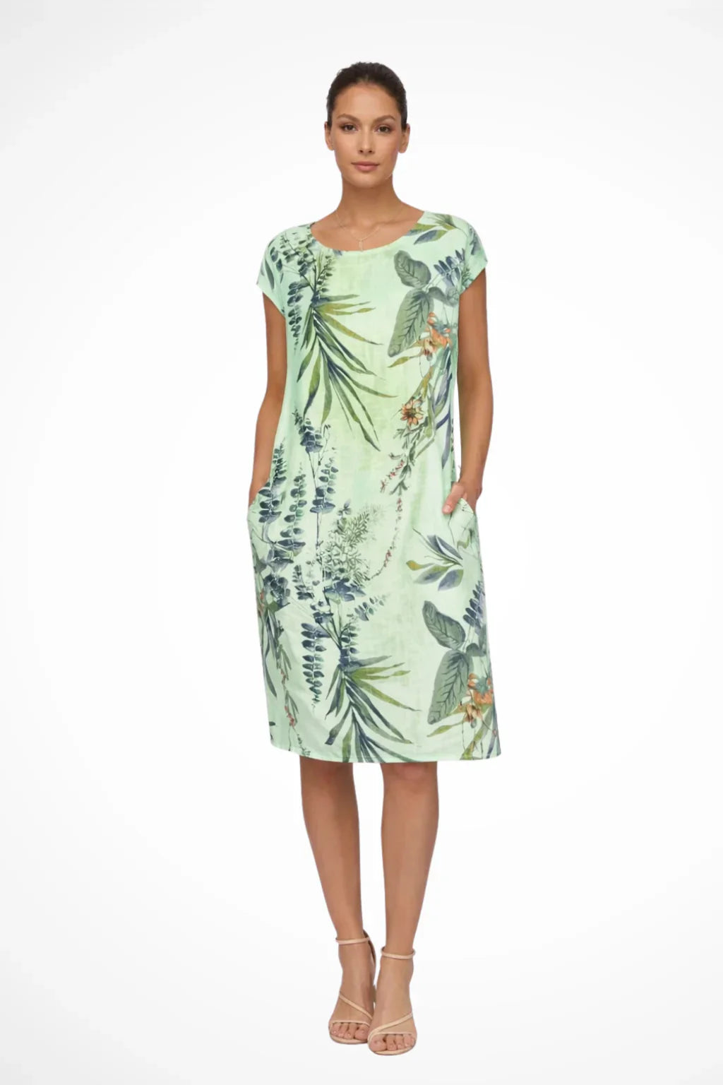 Summer shift dress in white base with green and brown botanical foliage print