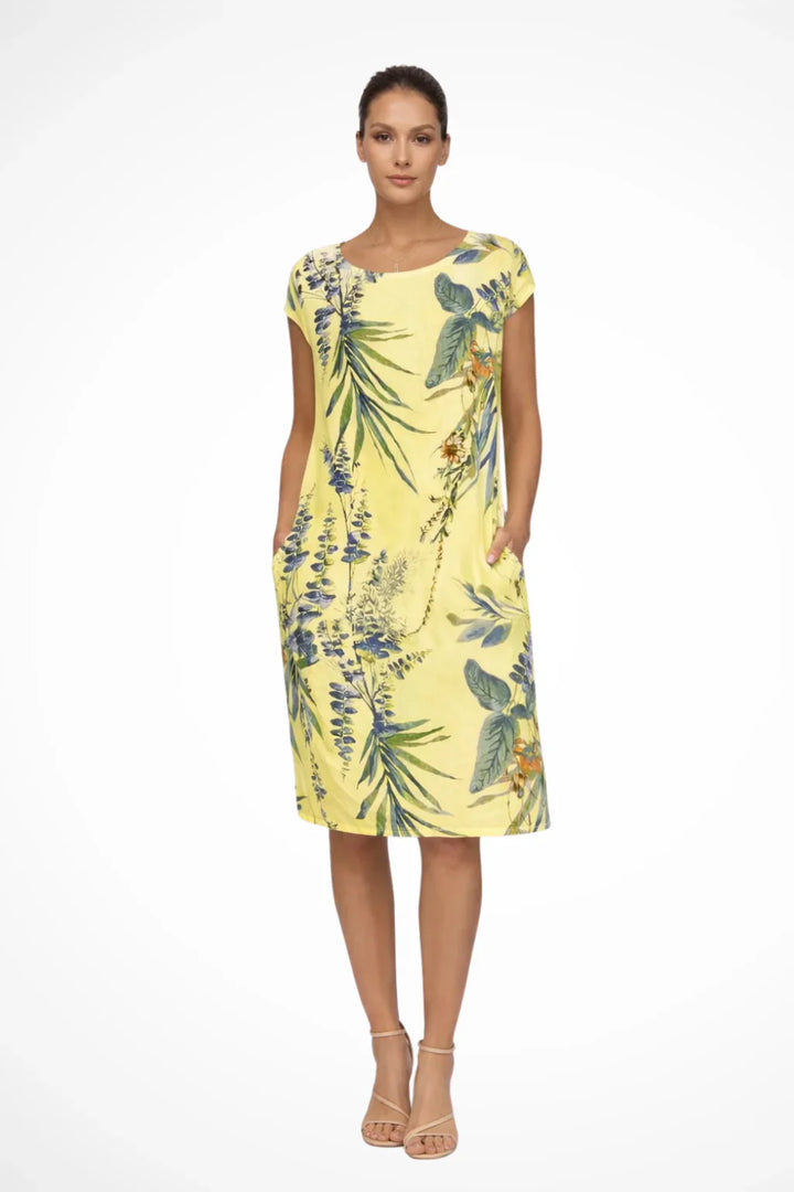Botanical print dress with round neck and knee length hem for warm weather dressing