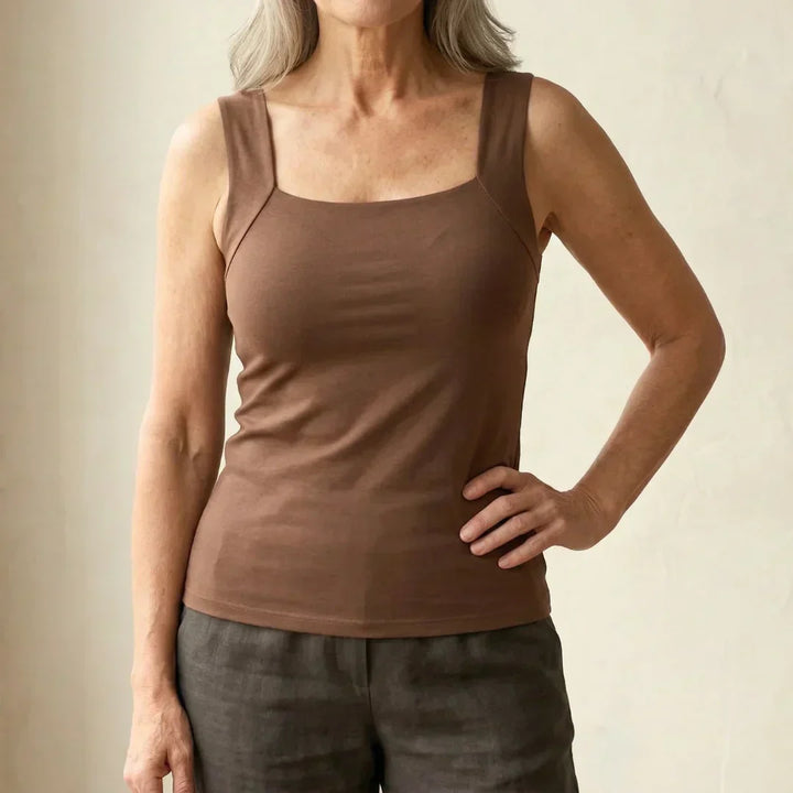 Woman wearing Eden Built In Comfort Bra Tanktop in taupe with square neckline and wide supportive straps