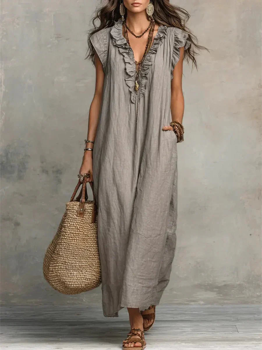 Grey ruffle V-neck maxi dress with flutter cap sleeves and flowing ankle-length silhouette