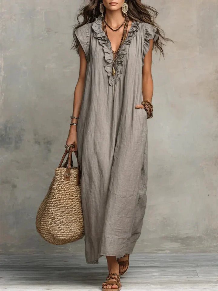 Grey ruffle V-neck maxi dress with flutter cap sleeves and flowing ankle-length silhouette