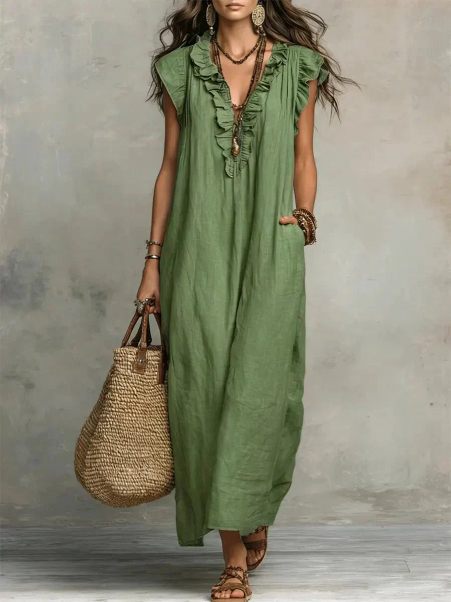 Close-up of cascading ruffle trim detail on V-neckline and front placket of maxi dress