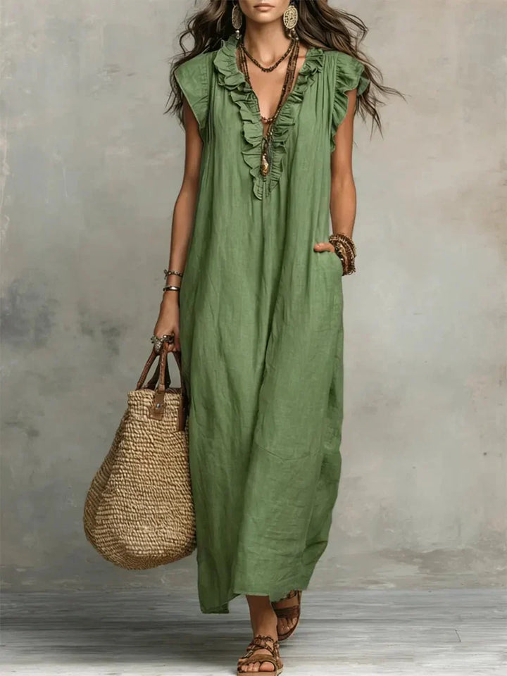 Close-up of cascading ruffle trim detail on V-neckline and front placket of maxi dress