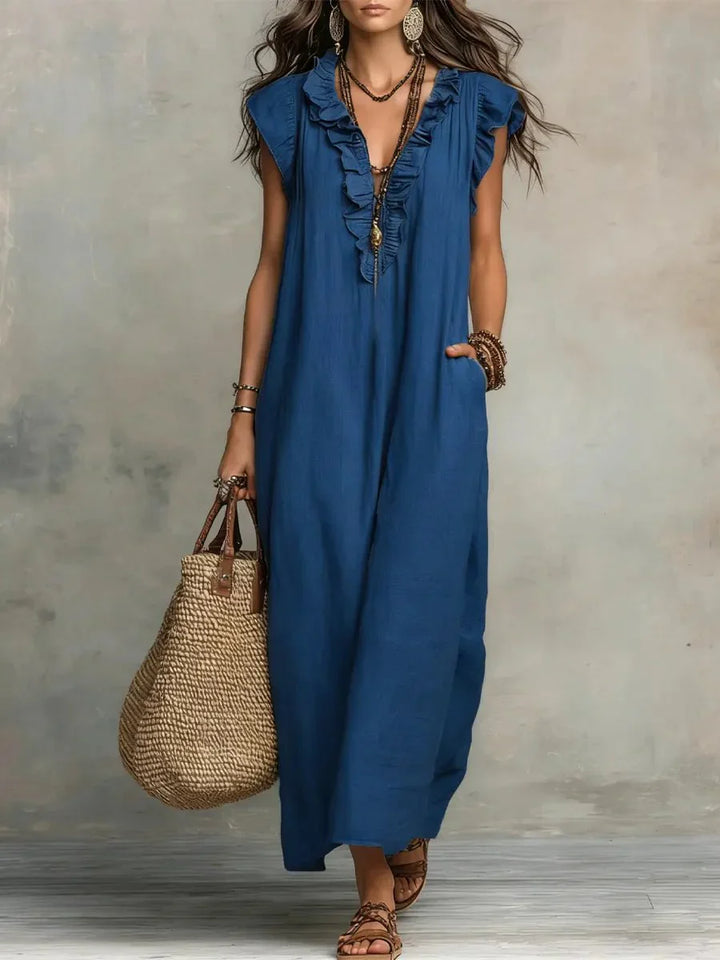 Side view of relaxed-fit maxi dress showing natural drape and discreet side pockets