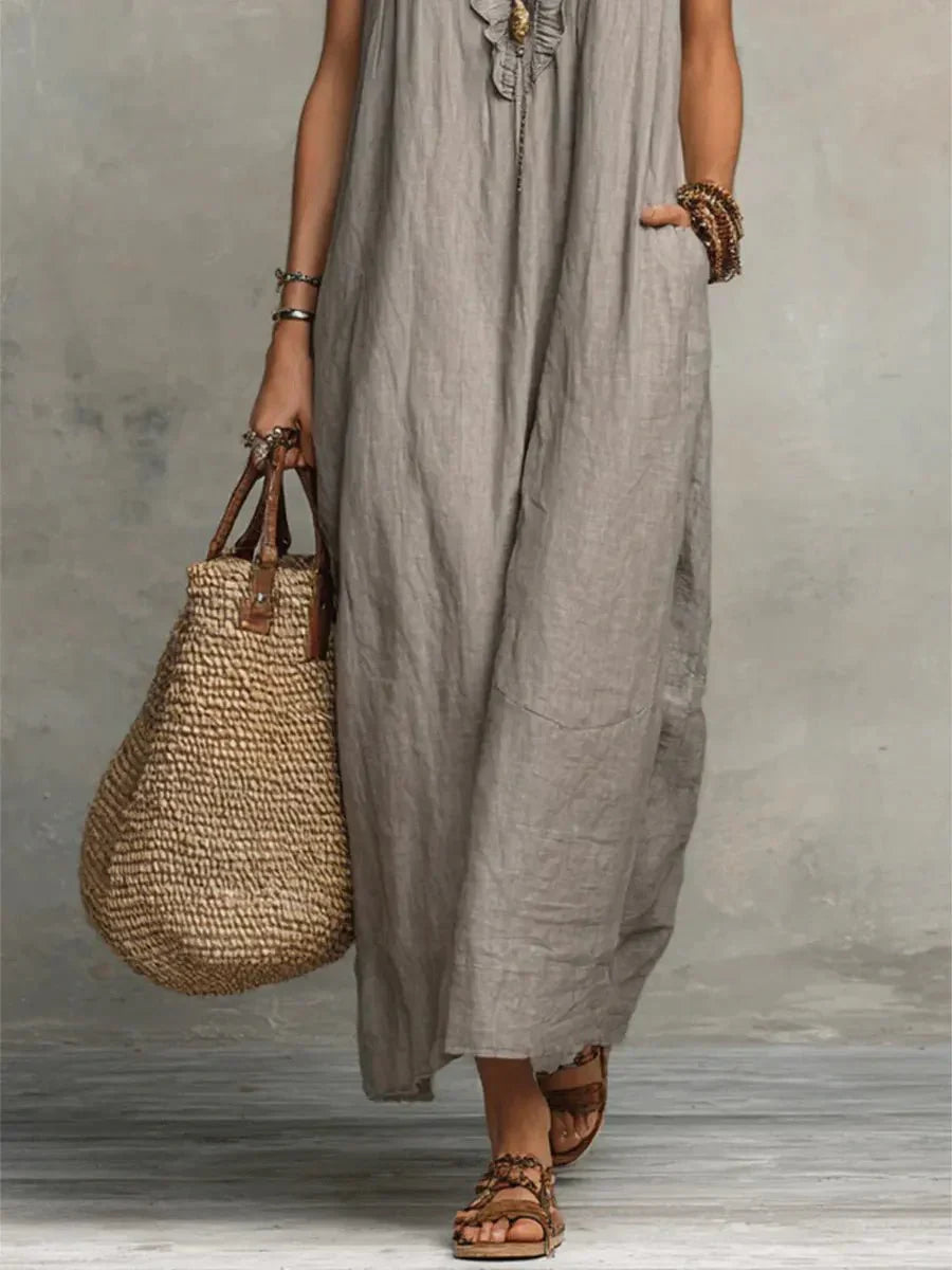 Front view of V-neck maxi dress showing relaxed fit and ankle-length hem