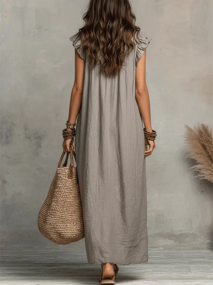 Close-up of discreet side pockets on relaxed-fit maxi dress
