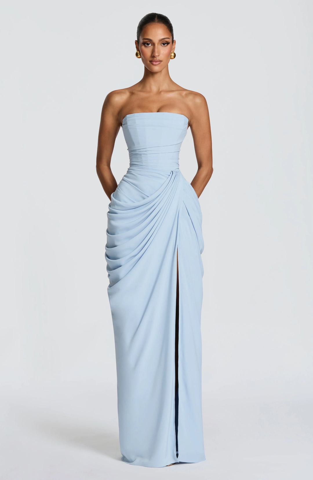 Front view of strapless maxi dress showing structured bodice and flowing skirt with split
