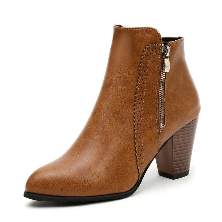 Side view of pointed toe ankle boots with smooth upper and comfortable heel height