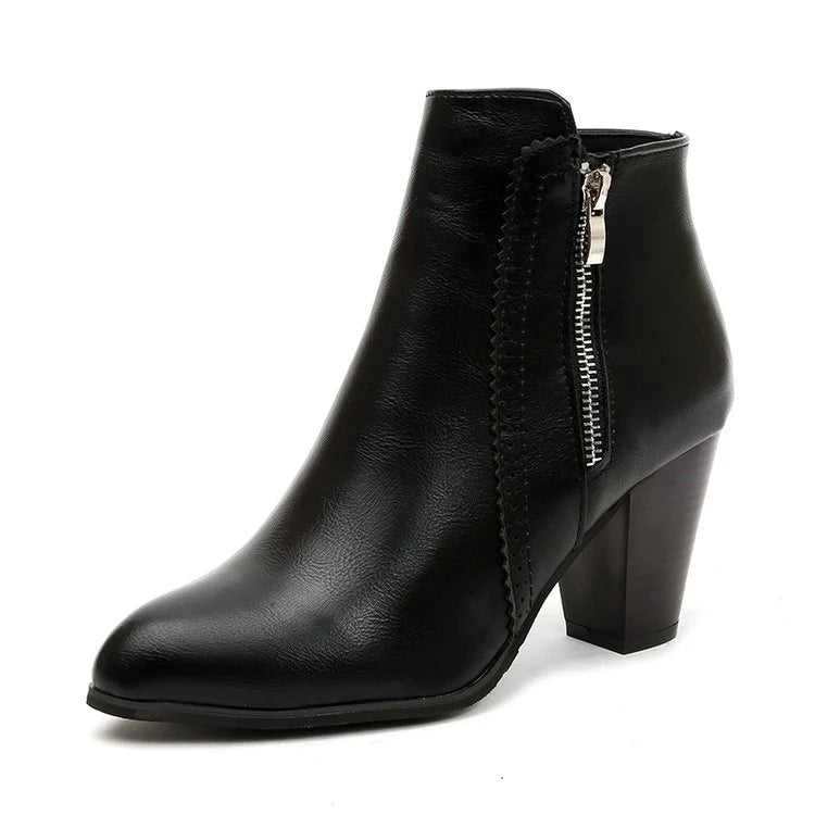 Pair of women's zip-up ankle boots showing structured silhouette and heel design