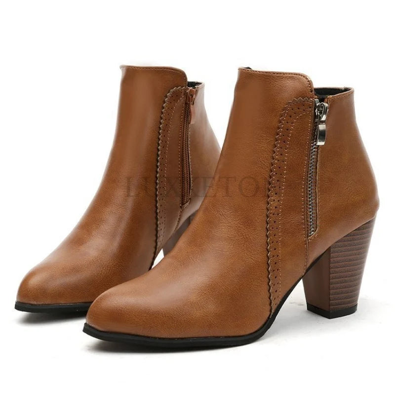 Detail of side zip fastening and block heel on women's ankle boots for versatile styling