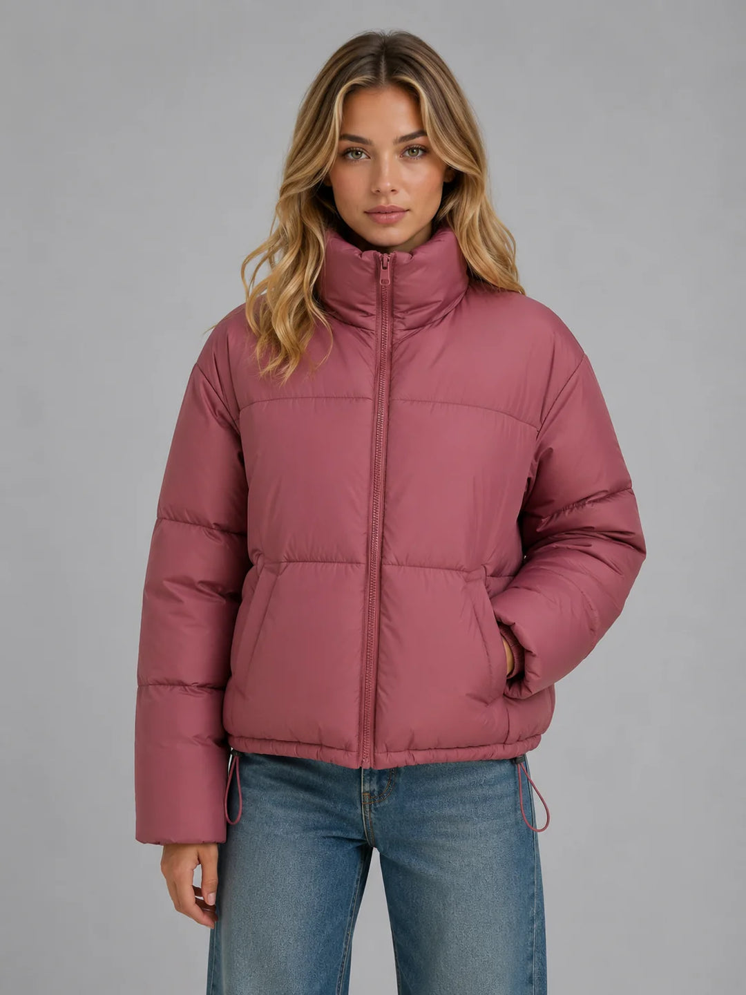 Women's black puffer jacket with oversized fit and high collar for cold-weather layering