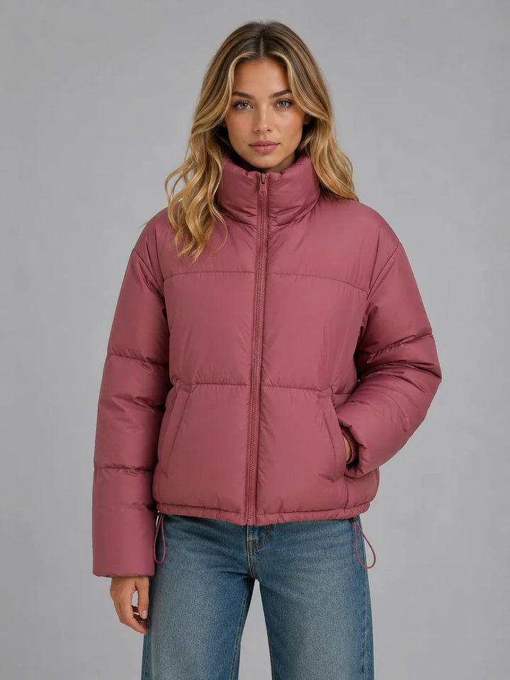 Women's black puffer jacket with oversized fit and high collar for cold-weather layering
