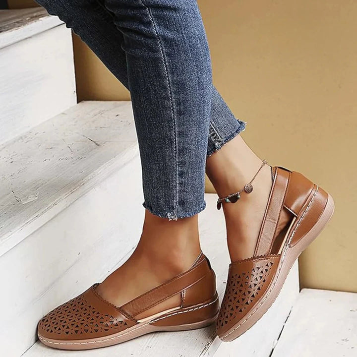 Overhead view of women's slip-on flats showing cushioned insole and elasticated side gusset construction