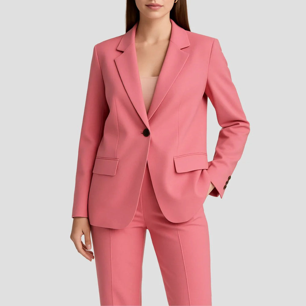 Close-up of women's beige tailored blazer with notched lapels and front flap pockets paired with matching trousers