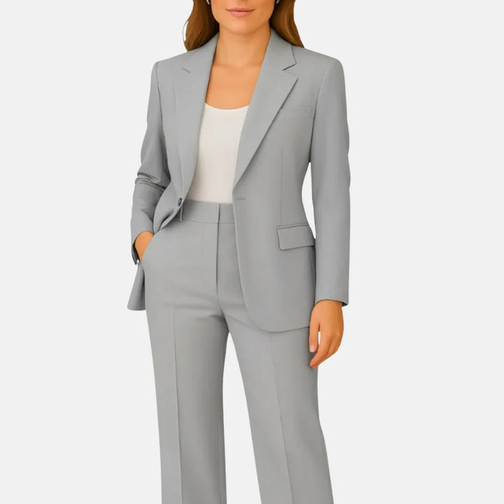 Women's beige tailored suit blazer detail showing single-button closure and clean lapel lines