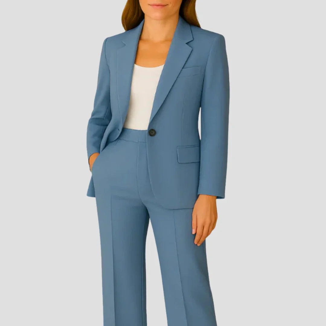 Full-length view of women's beige tailored blazer trouser suit with mid-rise straight-leg trousers