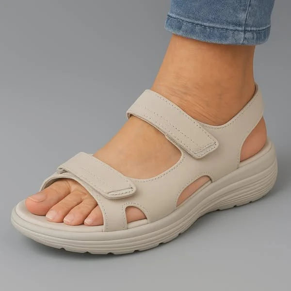 Close-up of women's navy walking sandals showing adjustable strap closure and contrast stitching detail