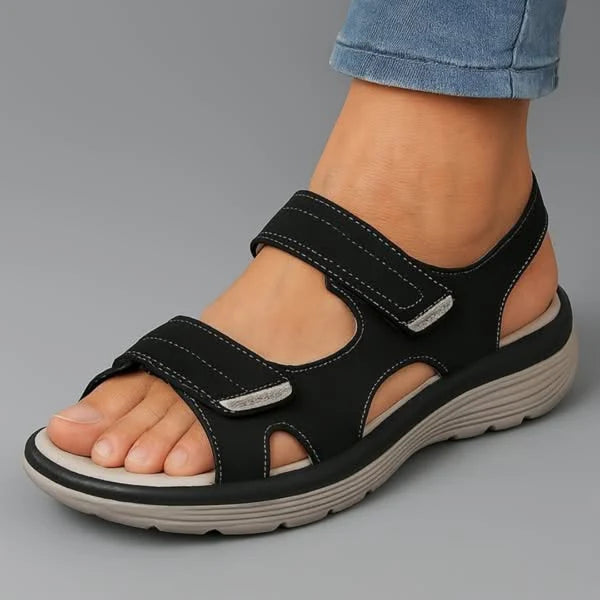 Side view of women's walking sandals displaying contoured sole and secure heel counter design