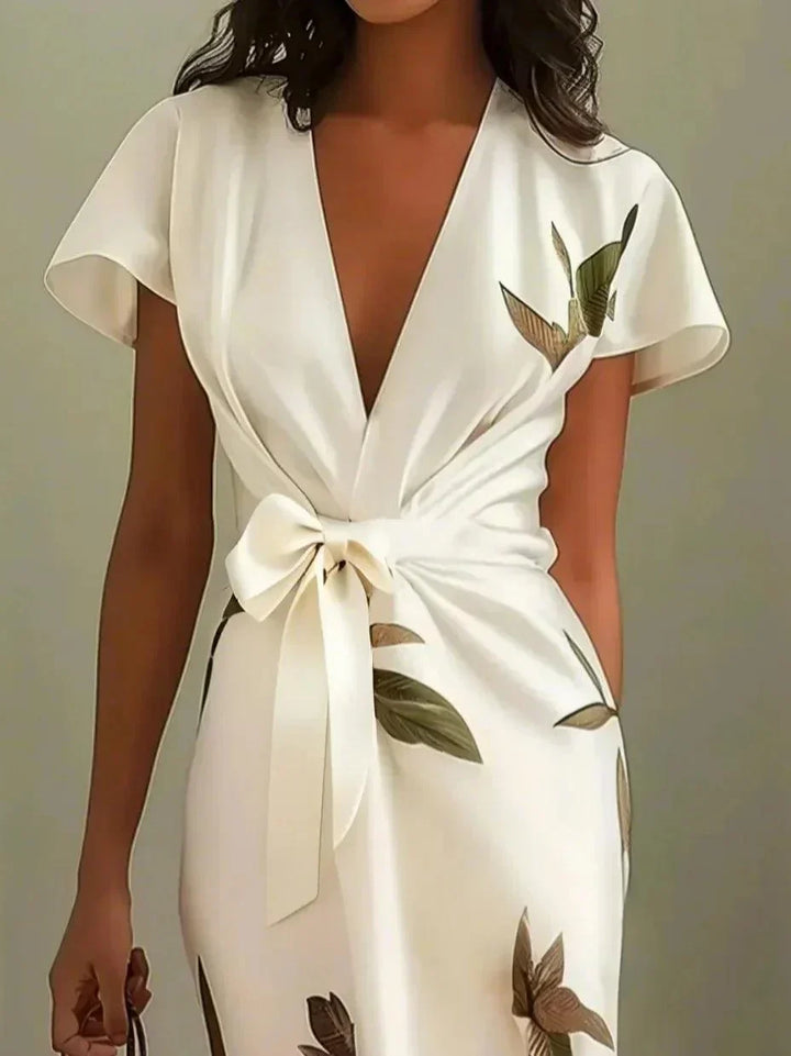 Close-up detail of botanical leaf print on wrap dress fabric