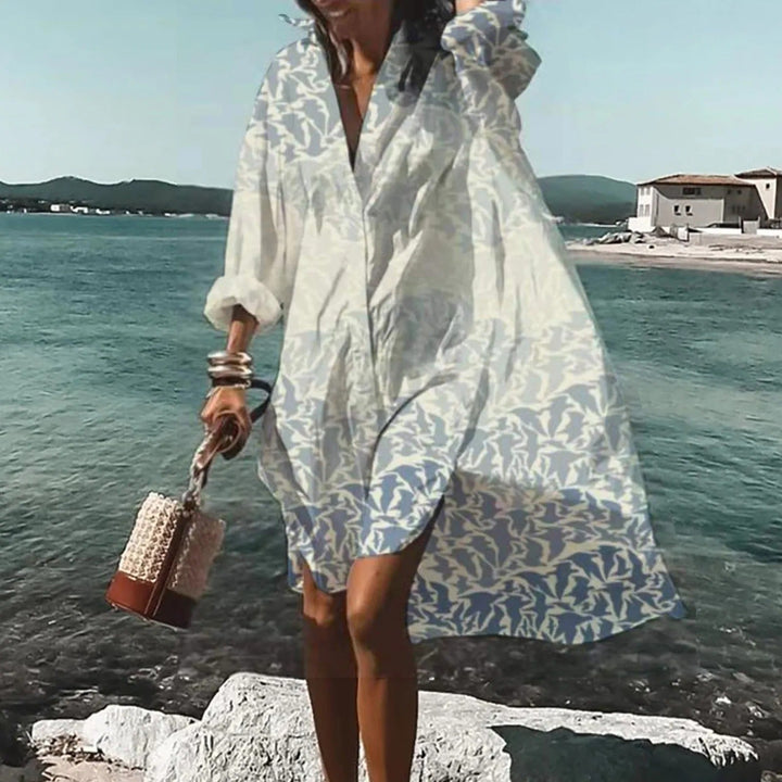 Woman wearing Women's Summer Casual Shirt Dress in botanical print with relaxed silhouette by the seaside